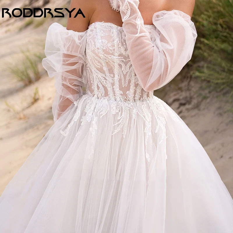 RODDRSYA רומנטי סטרפלס פנס שרוול שמלת חתונה אלגנטית אפליקציות קו שמלות כלה סקסית חשופת גב טול כלת המסיבה. התמונה 2